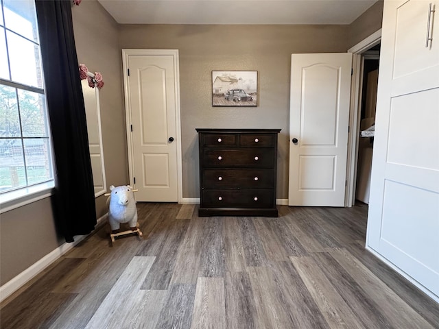 unfurnished bedroom with hardwood / wood-style flooring