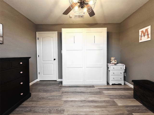 bedroom featuring hardwood / wood-style flooring and ceiling fan