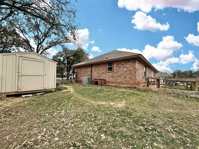 exterior space with a storage unit and central AC