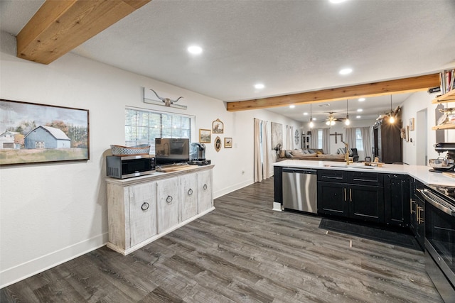 kitchen with beamed ceiling, appliances with stainless steel finishes, dark hardwood / wood-style flooring, and hanging light fixtures