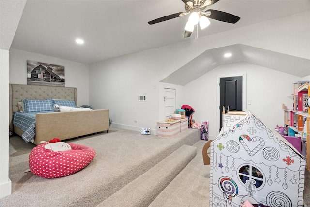 bedroom with ceiling fan, lofted ceiling, and carpet floors