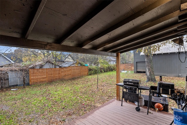 wooden deck featuring a yard