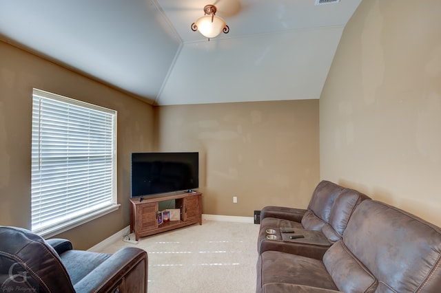 living room featuring carpet floors and lofted ceiling