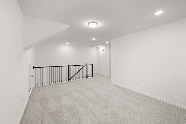 bonus room with light carpet