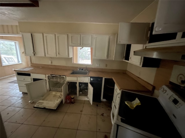 kitchen with white cabinets, white gas stove, sink, and a wealth of natural light