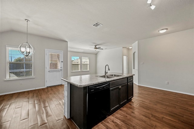 kitchen with a center island with sink, dishwasher, pendant lighting, and sink