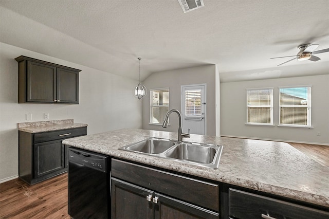 kitchen featuring dishwasher, sink, vaulted ceiling, dark hardwood / wood-style floors, and decorative light fixtures