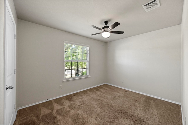 carpeted empty room with ceiling fan