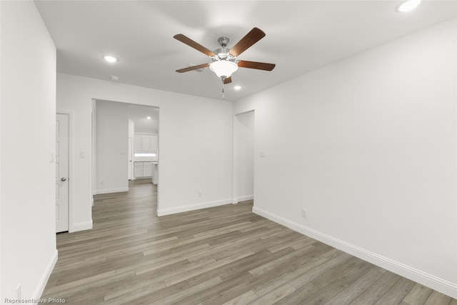 spare room with ceiling fan and light hardwood / wood-style flooring