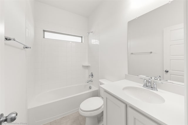 full bathroom featuring tile patterned flooring, vanity, toilet, and tiled shower / bath