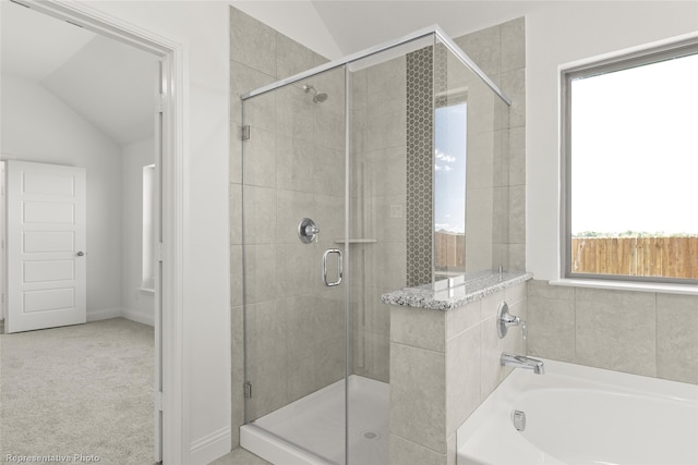 5617 Burford Ln, Celina, TX 75009 - bathroom with lofted ceiling, a garden tub, and a shower stall