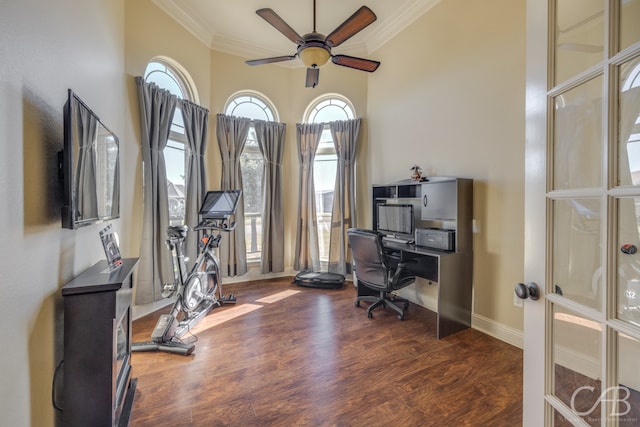 office with ornamental molding, ceiling fan, and dark wood-type flooring