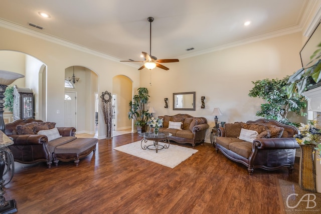 living room with ceiling fan, dark wood-type flooring, and ornamental molding