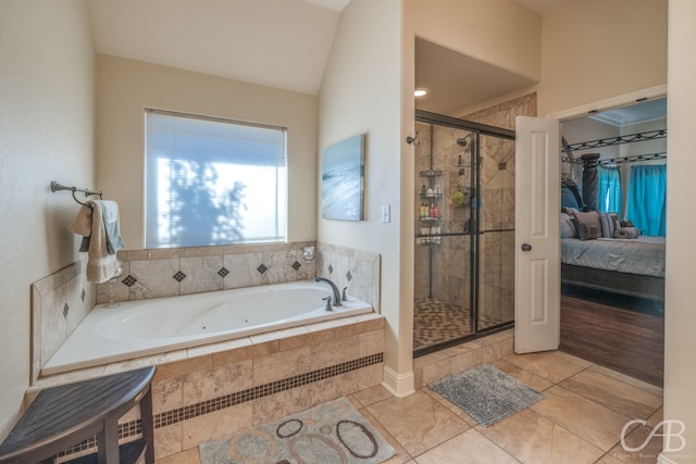 bathroom with plus walk in shower, tile patterned flooring, and lofted ceiling