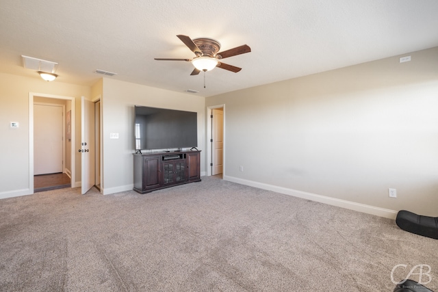 unfurnished living room featuring light carpet and ceiling fan