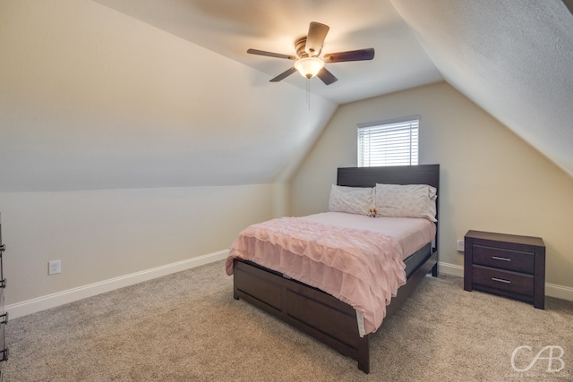 carpeted bedroom featuring ceiling fan and lofted ceiling