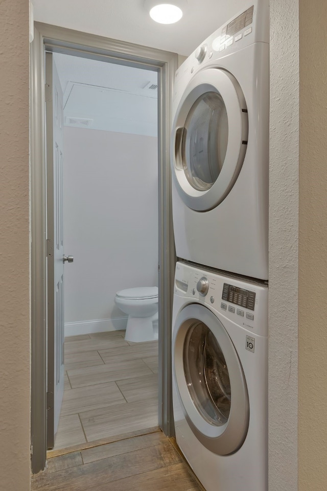 washroom with stacked washer / dryer