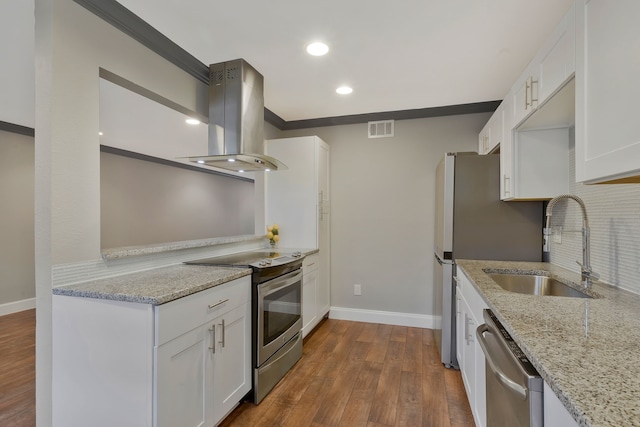 kitchen featuring sink, stainless steel appliances, light stone counters, white cabinets, and exhaust hood