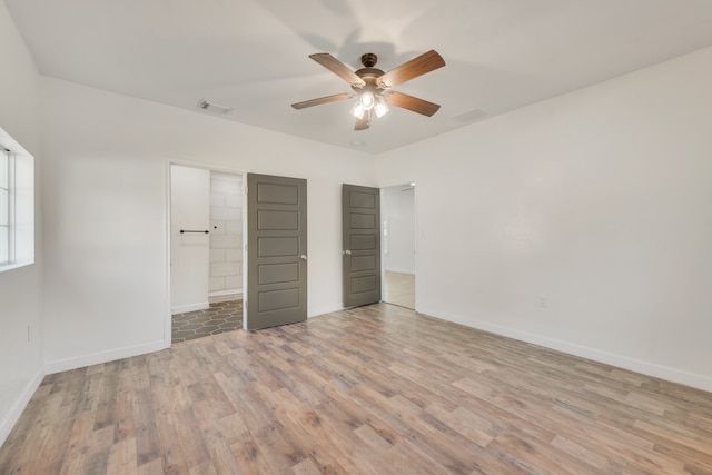 unfurnished bedroom featuring ceiling fan and light hardwood / wood-style floors