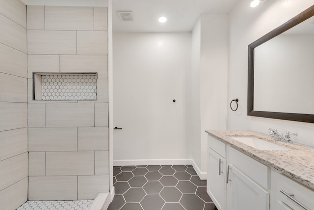 bathroom featuring tile patterned floors and vanity