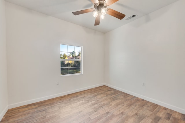 empty room with light hardwood / wood-style flooring and ceiling fan