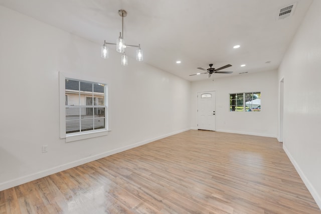 unfurnished room featuring ceiling fan and light wood-type flooring