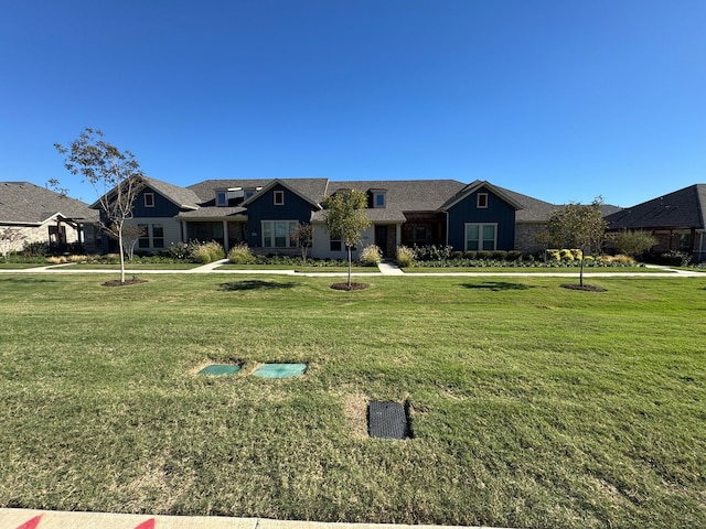 ranch-style home with a front lawn