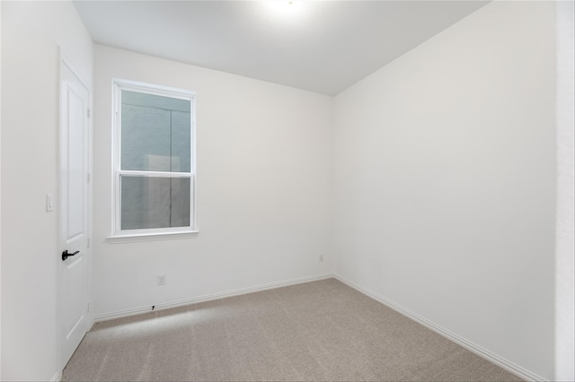 unfurnished room with light colored carpet