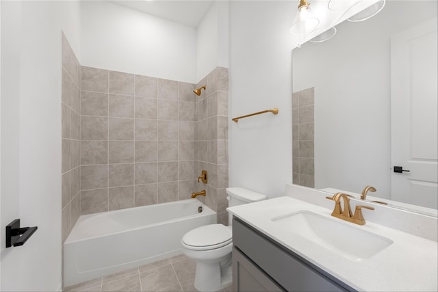 full bathroom featuring toilet, vanity, tiled shower / bath combo, and tile patterned floors