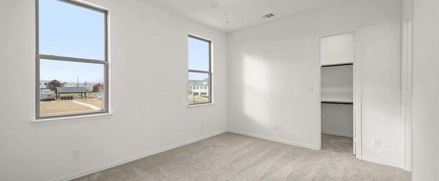 spare room with light carpet