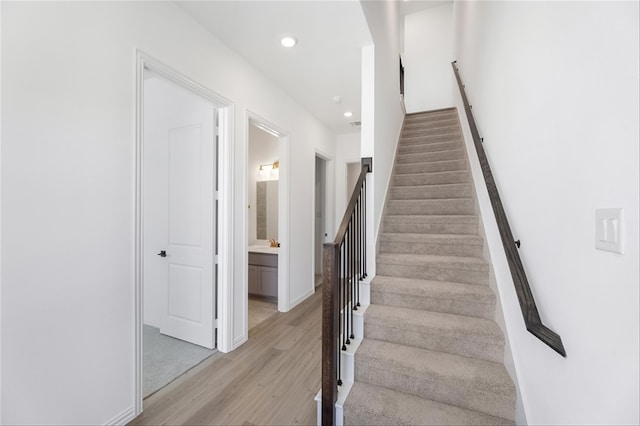 staircase featuring hardwood / wood-style floors