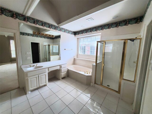 bathroom with tile patterned flooring, vanity, and separate shower and tub