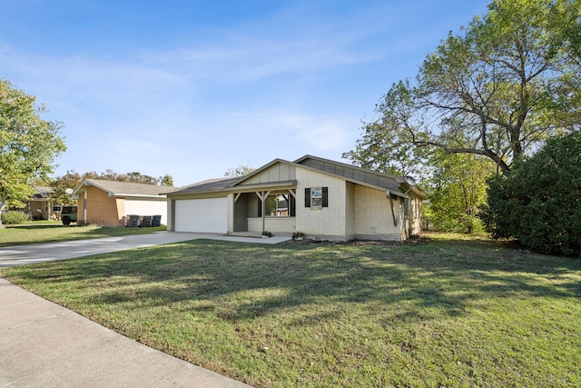 ranch-style house featuring a front lawn, a porch, and a garage