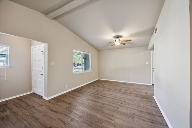 unfurnished room with hardwood / wood-style floors, plenty of natural light, vaulted ceiling with beams, and ceiling fan