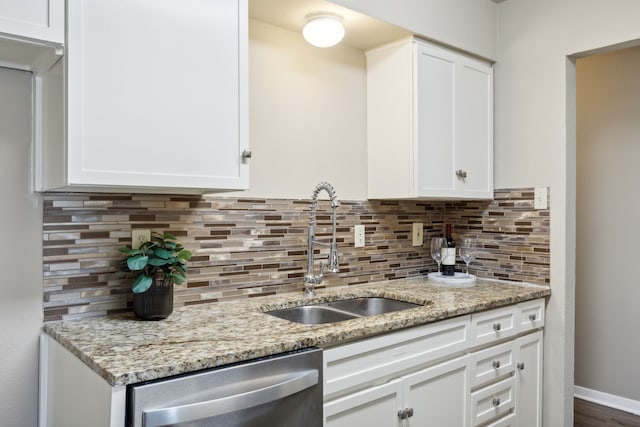 kitchen with white cabinetry and sink