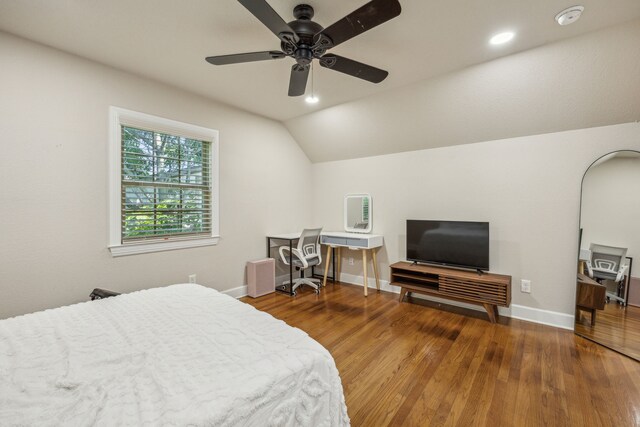 bedroom featuring ceiling fan, hardwood / wood-style floors, and vaulted ceiling