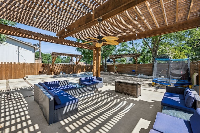 view of patio featuring a pergola, a trampoline, and an outdoor hangout area