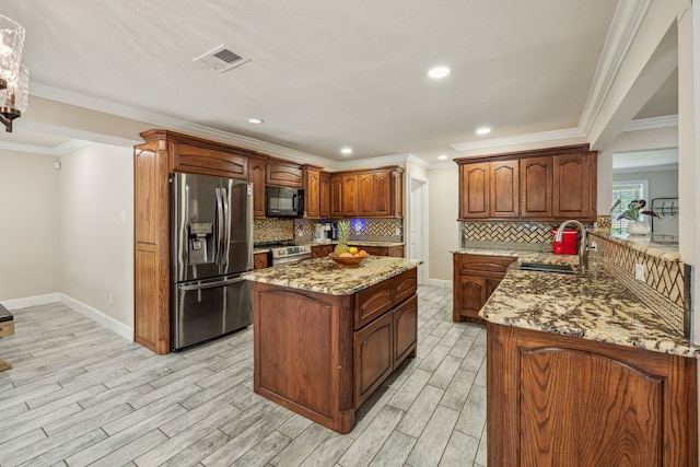 kitchen featuring backsplash, ornamental molding, stainless steel appliances, sink, and light hardwood / wood-style flooring