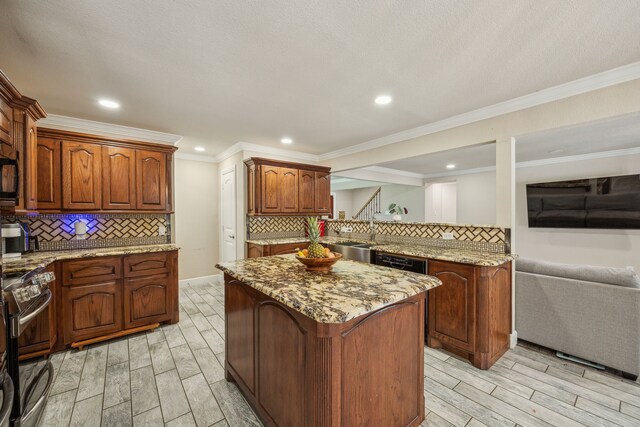 kitchen featuring black appliances, light hardwood / wood-style floors, light stone counters, and backsplash