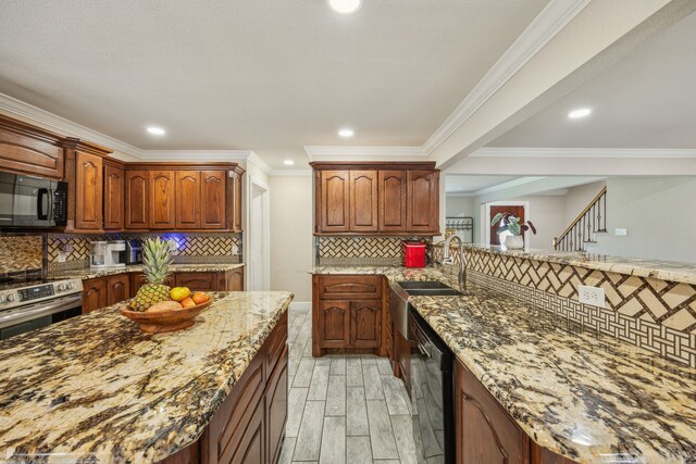 kitchen featuring black appliances, decorative backsplash, light stone countertops, ornamental molding, and light hardwood / wood-style floors