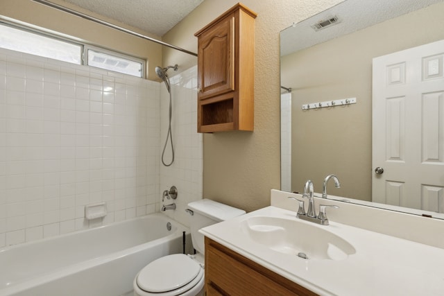1306 Woodmont Dr, Allen, TX 75002 - bathroom with toilet, a textured ceiling, shower / tub combination, and vanity