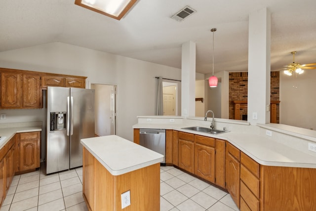 1306 Woodmont Dr, Allen, TX 75002 - kitchen with appliances with stainless steel finishes, a sink, light countertops, light tile patterned flooring, and vaulted ceiling