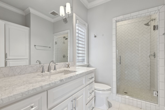 bathroom with toilet, vanity, tile patterned floors, and ornamental molding