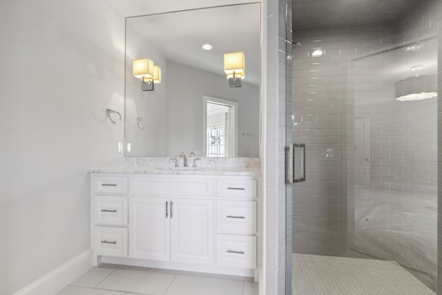 bathroom with tile patterned flooring, vanity, and a shower with shower door