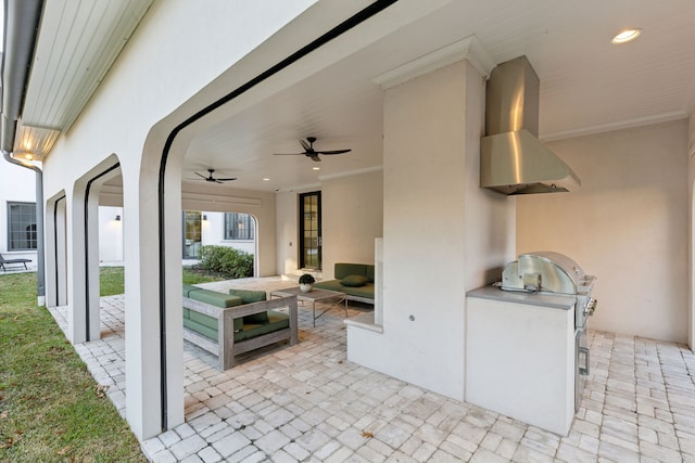 view of patio with ceiling fan, exterior kitchen, and an outdoor living space