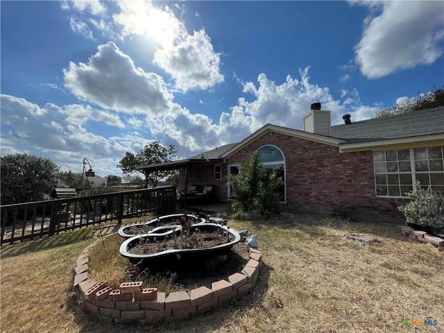 view of yard with an outdoor fire pit