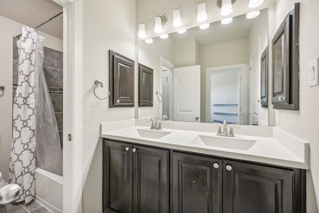 bathroom featuring shower / tub combo and vanity