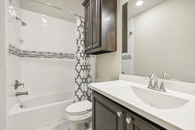 full bathroom featuring vanity, toilet, and shower / bath combo with shower curtain