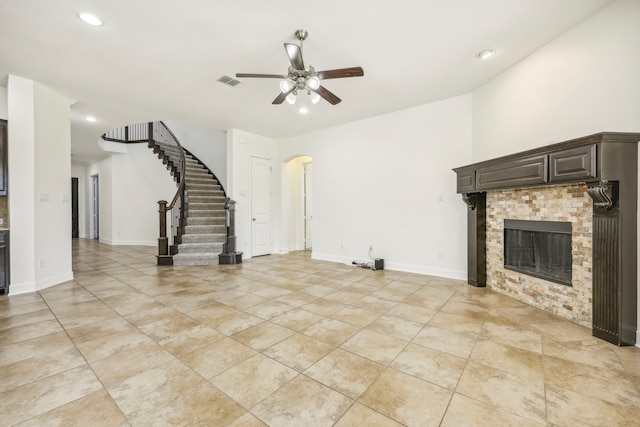 unfurnished living room with ceiling fan