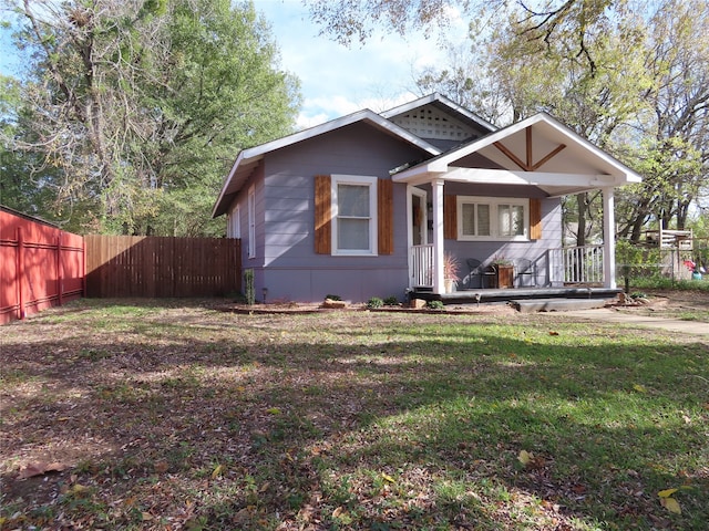 bungalow-style house with a front yard and a porch